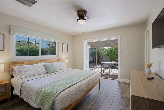 King bedroom with patio access