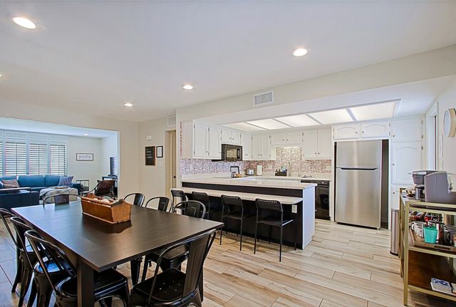 Dining table for the whole group next to the kitchen