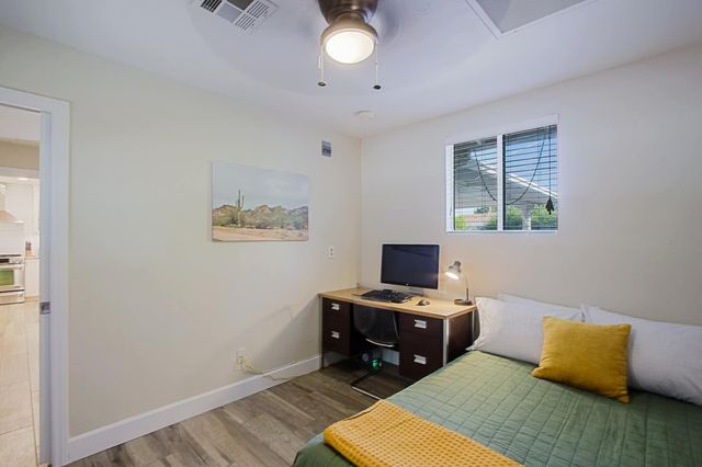 Dedicated office with desk and daybed